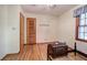 Simple bedroom with hardwood floors and a window at 810 Mcconnell Rd, Powder Springs, GA 30127