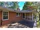 Back deck with screened porch and wooded views at 810 Mcconnell Rd, Powder Springs, GA 30127