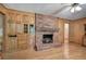Living room with brick fireplace, hardwood floors and built-in cabinetry at 810 Mcconnell Rd, Powder Springs, GA 30127