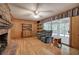 Living room includes hardwood floors, fireplace, and access to a sunroom at 810 Mcconnell Rd, Powder Springs, GA 30127