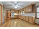 Kitchen boasts ample wood cabinets, hardwood floors, and white appliances at 810 Mcconnell Rd, Powder Springs, GA 30127