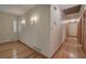 Bright hallway with hardwood floors and built-in wall sconces at 810 Mcconnell Rd, Powder Springs, GA 30127