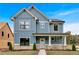 Two-story home with blue siding, white trim, and a covered porch at 38 Puckett Se Rd, Emerson, GA 30137