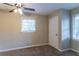 Bedroom with ceiling fan, window, and closet at 929 Pine Roc Dr, Stone Mountain, GA 30083