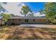Spacious backyard with patio and mature trees at 929 Pine Roc Dr, Stone Mountain, GA 30083