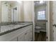 Clean bathroom with granite countertop and updated vanity at 929 Pine Roc Dr, Stone Mountain, GA 30083