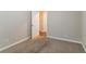 Bright bedroom featuring neutral walls and carpet flooring at 929 Pine Roc Dr, Stone Mountain, GA 30083