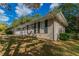 Brick ranch house with attached garage and landscaping at 929 Pine Roc Dr, Stone Mountain, GA 30083