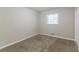 Simple bedroom with carpet flooring and neutral walls at 929 Pine Roc Dr, Stone Mountain, GA 30083