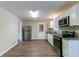 Updated kitchen features stainless steel appliances and granite countertops at 929 Pine Roc Dr, Stone Mountain, GA 30083