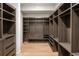 Spacious walk-in closet with custom built-ins and wood flooring at 1301 Peachtree St # 4L, Atlanta, GA 30309