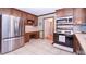 Kitchen boasts stainless steel appliances and wood cabinets at 801 Hampton Sw Pl, Marietta, GA 30064