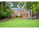 Brick home with gray shutters and yellow door at 801 Hampton Sw Pl, Marietta, GA 30064