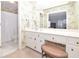 Bathroom with a vanity, toilet, and shower. Floral wallpaper and white cabinets at 801 Hampton Sw Pl, Marietta, GA 30064