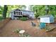 House backyard with deck, shed, and patio seating area at 801 Hampton Sw Pl, Marietta, GA 30064