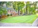 Brick home with gray shutters and yellow door at 801 Hampton Sw Pl, Marietta, GA 30064