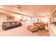 Spacious finished basement with seating area, built-in shelving, and access to backyard at 801 Hampton Sw Pl, Marietta, GA 30064