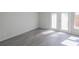 Spacious living room with gray vinyl flooring and French doors at 3158 Olive Tree Ct, Decatur, GA 30034