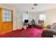 Living room with red carpet, and window coverings at 2243 Tiger Flowers Nw Dr, Atlanta, GA 30314