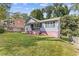 House exterior view, gray siding, pink base, and yard at 2243 Tiger Flowers Nw Dr, Atlanta, GA 30314