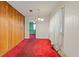 Dining room with wood paneling and red carpet at 2243 Tiger Flowers Nw Dr, Atlanta, GA 30314