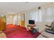 Living room with red carpet and window coverings at 2243 Tiger Flowers Nw Dr, Atlanta, GA 30314