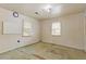 Simple bedroom with two windows and wall-to-wall carpet at 2243 Tiger Flowers Nw Dr, Atlanta, GA 30314