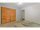 Bedroom with double doors and closet, showing a view of another room at 2243 Tiger Flowers Nw Dr, Atlanta, GA 30314