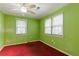 Bedroom with green walls, red carpet, and window blinds at 2243 Tiger Flowers Nw Dr, Atlanta, GA 30314