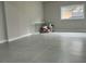 Unfinished basement with gray tile flooring and a window at 6848 Maddox Rd, Morrow, GA 30260