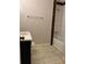 Updated bathroom with white tub and dark brown accents at 198 Lucan Way, Riverdale, GA 30274