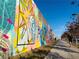 Vibrant mural art along a walking path with a person jogging at 764 Edgewood Ne Ave # 1, Atlanta, GA 30307