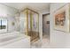 Bathroom with a walk-in shower and tiled walls at 2660 Peachtree Nw Rd # 18G, Atlanta, GA 30305