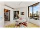 Bright dining area with city views and access to the kitchen at 2660 Peachtree Nw Rd # 18G, Atlanta, GA 30305