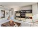 Living room with built-in shelving and ample natural light at 2660 Peachtree Nw Rd # 18G, Atlanta, GA 30305