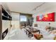 Spacious living room with large windows, city views, and comfortable seating at 2660 Peachtree Nw Rd # 18G, Atlanta, GA 30305