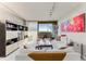 Bright living room with white sofas and city view at 2660 Peachtree Nw Rd # 18G, Atlanta, GA 30305