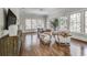 Sunroom with hardwood floors, large windows, and a seating area at 57 Northwood Ne Ave, Atlanta, GA 30309
