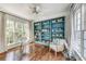 Home office with hardwood floors, built-in shelving, and a glass desk at 57 Northwood Ne Ave, Atlanta, GA 30309