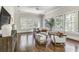 Sunroom with hardwood floors, large windows, and a seating area at 57 Northwood Ne Ave, Atlanta, GA 30309