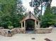 Stone entryway with a wooden gazebo and community signage at 57 Northwood Ne Ave, Atlanta, GA 30309