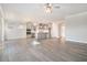 Open concept kitchen and living area with modern gray color scheme and wood-look flooring at 5810 Collier Bridge, Hoschton, GA 30548