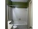 Clean bathroom with white tiled shower and bathtub at 1101 Lenox Ne Way # 1101, Atlanta, GA 30324