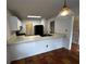 Kitchen boasts a breakfast bar, black appliances, and an open layout at 1101 Lenox Ne Way # 1101, Atlanta, GA 30324