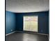 Spacious bedroom with dark gray floors and a large window at 1101 Lenox Ne Way # 1101, Atlanta, GA 30324