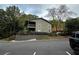 Exterior view of condo building nestled in trees at 1101 Lenox Ne Way # 1101, Atlanta, GA 30324