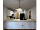 Bright kitchen features a breakfast bar, updated appliances, and ample counter space at 1101 Lenox Ne Way # 1101, Atlanta, GA 30324
