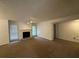 Spacious living room with fireplace and carpet at 1101 Lenox Ne Way # 1101, Atlanta, GA 30324