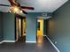 Spacious bedroom with dark gray floors and multiple doors at 1101 Lenox Ne Way # 1101, Atlanta, GA 30324
