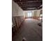 Living room undergoing renovation with exposed framing and flooring at 533 Riverbirch Trce, Stone Mountain, GA 30087